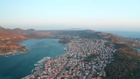 Aerial-high-panoramic-view-of-Argostoli-town-in-Kefalonia-Island-during-sunset,-Greece