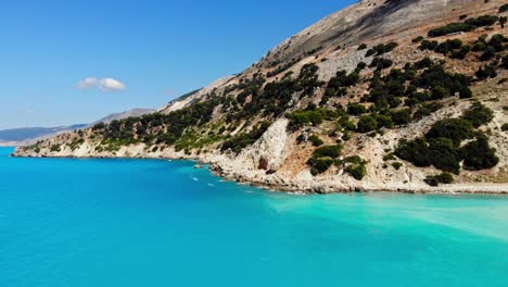 Lush-Cliffs-and-Blue-Ocean-At-Agia-Kiriaki-Beach-in-Kefalonia,-Greece---aerial-drone-shot