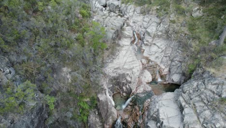 Aerial-top-down-forward-over-waterfalls-of-Portela-Do-Homem-in-Portugal