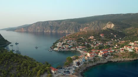 Aerial-pullback-from-Beautiful-Coastal-Village-Scenery,-Assos-village,-Greek-Island