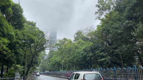 Kolkata,-Street-scene-ok-Kolkata-during-monsoon-with-clouds-covering-the-building-"the-42"