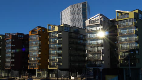 Sunlight-reflected-in-window-of-building-in-Gamlestaden,-Gothenburg