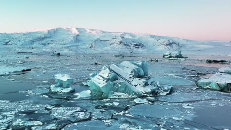 Jokulsarlon-Glacial-Lagoon-With-Blue-Waters-And-Icebergs-During-Sunrise-At-Winter-In-Iceland