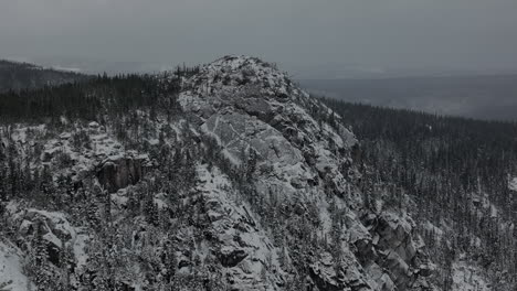 Snowy-Mountain-Peak-Of-Lac-A-L'empeche-In-Canada---aerial-shot