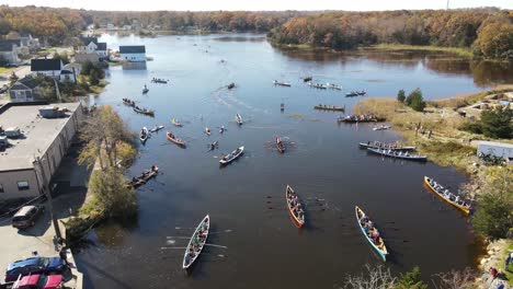 Aerial-high-altitude-footage-of-teams-of-canoe-racers-waiting-to-start-race