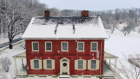 Old-red-brick-home-covered-in-winter-snow