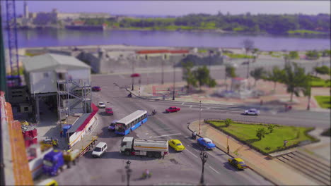 Miniature-world,-stop-motion,-cars-trucks-and-buses-at-a-busy-intersection