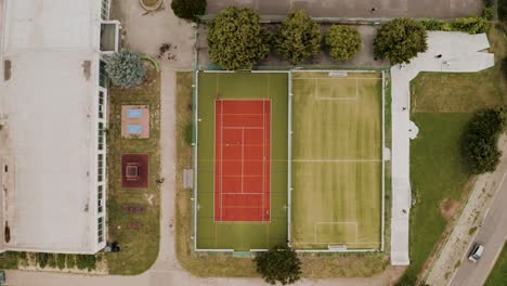 Aerial-top-down-view-of-a-multi-sport-field,-soccer-field,-table-tennis-tables-and-a-skate-park