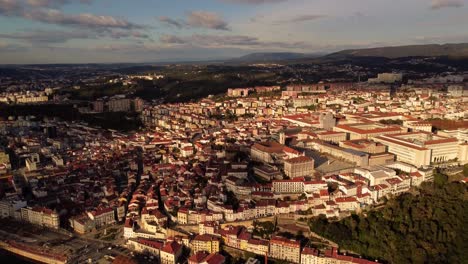 Aerial-view-of-coimbra-university-city-in-Portugal-drone-fly-above-the-center-during-golden-hour