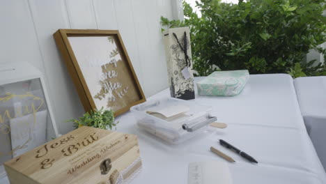 Wedding-venue-table-set-up-for-guests-to-leave-wedding-wishes