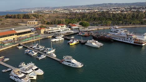Wide-aerial-establishing-show-of-boats-docked-at-the-Port-of-Pafos-in-the-earl-morning