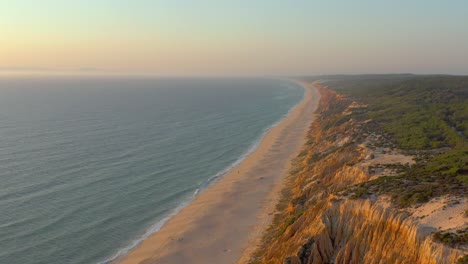 Aerial-panorama-view-of-Arriba-Fossil-da-Praia-da-Gale-Fontainhas-beach-Portugal,-seaside-rock-formations-canyon-erosion