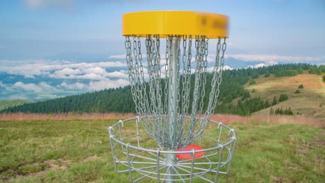 Zoom-in-of-frisbee-that-goes-to-basket,-Kope,-Slovenia