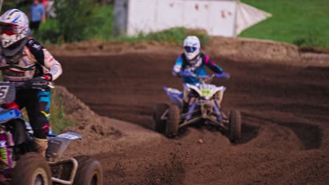 Quad-Racing-Competition---Racers-on-Dirt-Muddy-Passing-Extreme-Turn-in-Slow-Motion