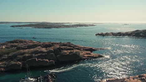 The-Wonderful-Scenery-In-Pinnevik,-Lysekil-Sweden-With-Blue-Calm-Water-and-Rocks---Aerial-Shot
