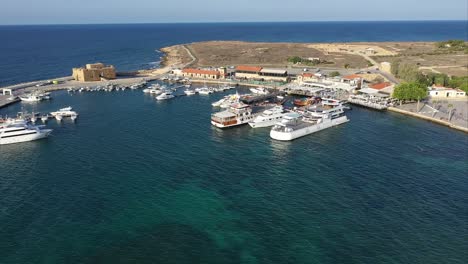 Stunning-aerial-establishing-shot-of-the-Port-of-Pafos-with-the-castle-in-view
