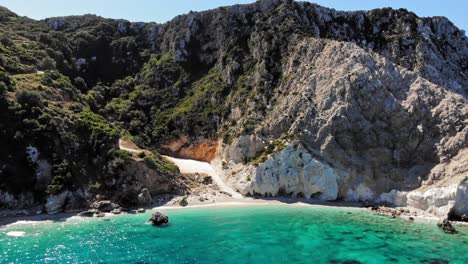 Pristine-Water-And-Forested-Cliffs-At-Agia-Eleni-Beach-In-Paliki,-Kefalonia-Island,-Greece