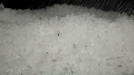 White-hail-storm-ice-balls-being-melted-with-water-drops