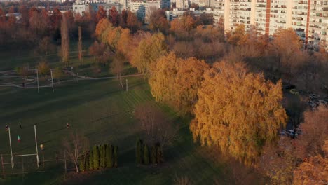 People-Playing-On-The-Rugby-Field-Outside-Mamutica-Apartment-Building-In-Zagreb,-Croatia-During-Autumn-Season