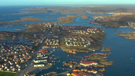 Drone-shot-of-Smogen-urban-development-on-islands,-Sweden-picturesque-houses-neighborhood