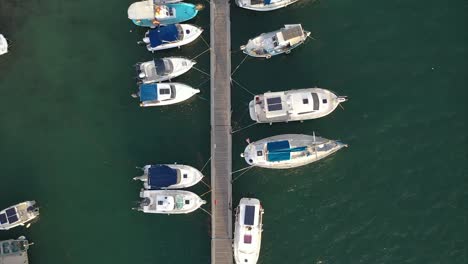 Bird's-eye-view-of-small-boats-docked-in-tropical-waters