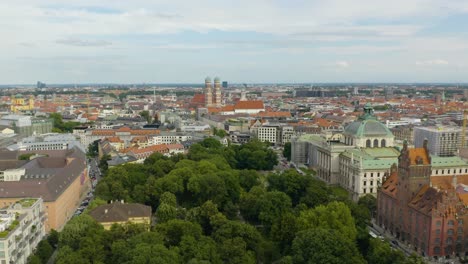 Drone-Descends-Above-Park-in-Downtown-Munich
