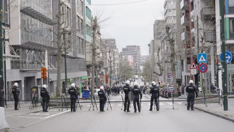 The-riot-police-holding-the-ground-during-riots,-protests-in-Brussels,-Belgium