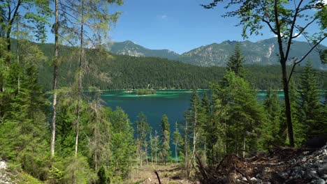 Beautiful-Eibsee-lake-in-Bavaria,-with-small-islands-turquoise-water-and-forest-around