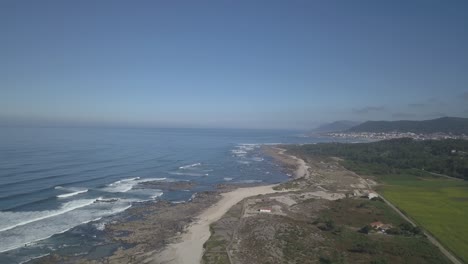 aerial-top-down-view-of-Afife-beach-at-Atlantic-Ocean-with-caminha-in-background-in-Portugal