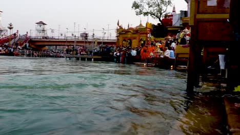 people-gathered-at-ganges-aarti-religious-pryer-at-evening-at-river-bank-video-is-taken-at-har-ki-pauri-haridwar-uttrakhand-india-on-Mar-15-2022