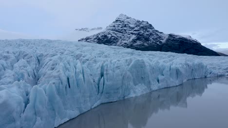 Ascending-drone-shot-of-Fjallsárjökull-glacier-and-Vatnajökull-glacier-in-Iceland