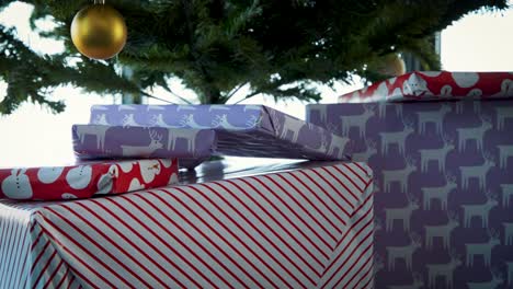 Presents-under-artificial-tree-neatly-wrapped-in-christmas-paper