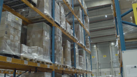Tilt-down-of-high-rack-in-industrial-warehouse