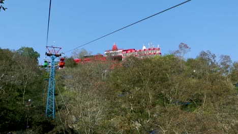 rope-way-running-through-green-forests-to-mountain-top-video-is-taken-at-Mansa-Devi-Temple-rope-way-haridwar-uttrakhand-india-on-Mar-15-2022