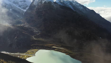 Cinematic-aerial-shot-of-the-Steinsee-Lake-along-the-Susten-Pass,-Switzerland