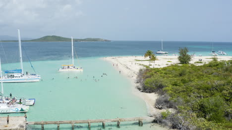 Yachts-in-Boat-Docks-with-Tourists-Enjoying-Cayo-Icacos-Beach---Aerial