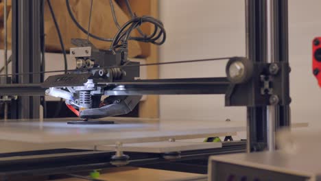 A-3D-printer-has-just-started-printing-something-and-is-laying-down-the-first-layers