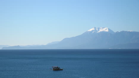 Small-Turkish-fishing-boat-crossing-a-section-of-the-calm-Mediterranean-Sea-in-Antalya,-Turkey