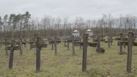 Wide-pan-of-old-gravestones-at-abandoned-graveyard
