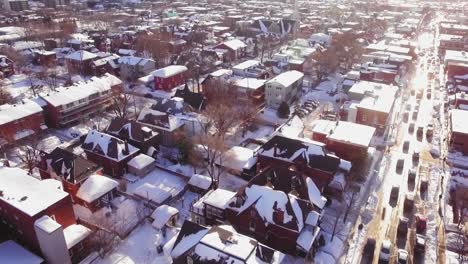 Gorgeous-raising-aerial-shot-of-a-snow-covered-center-town-suburb-in-Ottawa,-Ontario,-Canada