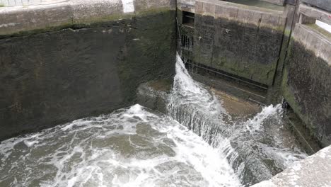 Canal-lock-gates-letting-water-in-to-have-chamber-filled