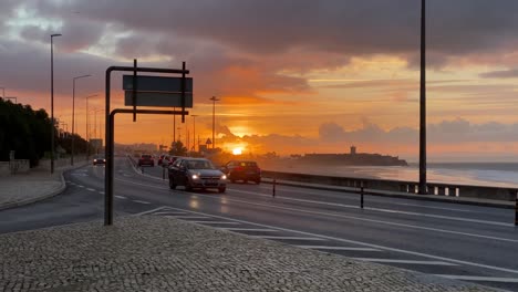 Silhouette-cars-moving-marginal-road-with-a-golden-sunrise-at-golden-hour-in-honey-sun-or-travel-concept