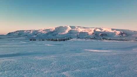 Sunset-glow-over-the-white-Jokusarlon-Glacier-Lagoon-in-Iceland--Aerial