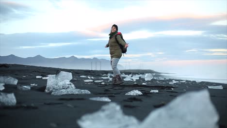 Happy-girl-spinning-around-in-an-Icelandic-landscape