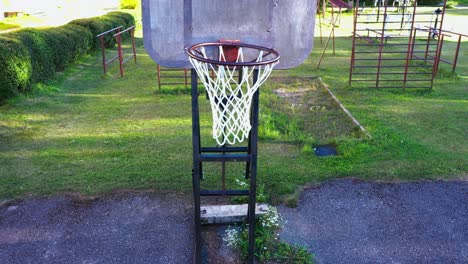 White-net-of-vintage-basketball-board-in-rural-area,-close-up-view
