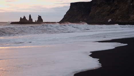 Waves-crash-on-an-Icelandic-black-sand-beach-in-Vik-Iceland
