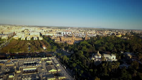 Aerial-shot-climbing-high-and-looking-down-La-Plaza-de-Espana-in-Seville,-Spain-4K-60fps