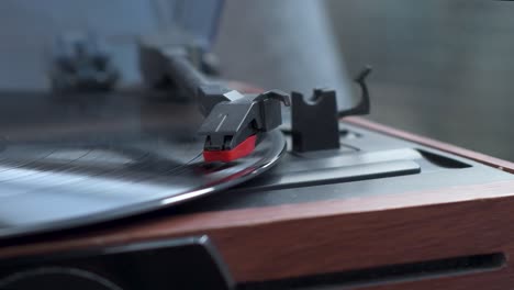 View-of-vinyl-record-spinning-on-turntable-while-music-playing