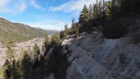 FPV-Rock-Face-in-Rocky-Mountains