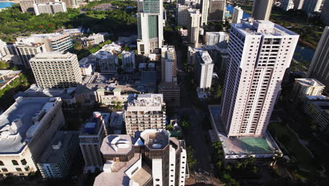 Slow-aerial-tracking-shot-tilted-down-to-view-buildings-and-skyscrapers-in-Honolulu-Hawaii